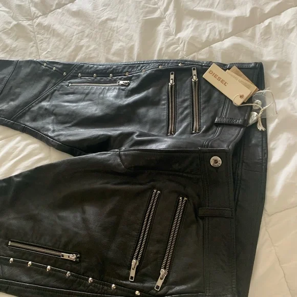 Diesel Leather Pants Mens with front and back pockets with zippers on them.
